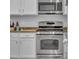 Well-equipped kitchen featuring stainless steel appliances and white cabinets at 15861 Starling Water Dr, Lithia, FL 33547