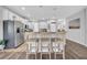 Bright kitchen features stainless steel appliances, granite countertops, and a breakfast bar with seating at 15861 Starling Water Dr, Lithia, FL 33547