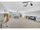 Spacious main bedroom with neutral carpet, ceiling fans, and large sunny window at 15861 Starling Water Dr, Lithia, FL 33547