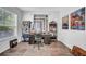 The office features wood floors, a window and shelves filled with books and various collectibles at 15861 Starling Water Dr, Lithia, FL 33547