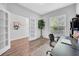 Inviting home office with wood floors, lots of natural light, and stylish french doors at 15861 Starling Water Dr, Lithia, FL 33547