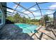 Inviting pool with brick patio within screened enclosure for relaxation and recreation at 15861 Starling Water Dr, Lithia, FL 33547
