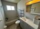 Bathroom featuring a modern vanity, tile flooring, and a shower-tub combination at 1830 Bough Ave # 4, Clearwater, FL 33760