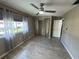 Bedroom featuring modern ceiling fan, window, neutral walls, and wood-look floors at 1830 Bough Ave # 4, Clearwater, FL 33760