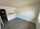 Bedroom featuring neutral walls, wood-look flooring and access to the hall at 1830 Bough Ave # 4, Clearwater, FL 33760