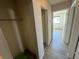 Hallway featuring luxury vinyl plank flooring and access to a closet and other rooms at 1830 Bough Ave # 4, Clearwater, FL 33760