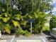 View of the Eastwood Pines Guest Parking sign surrounded by lush greenery at 1830 Bough Ave # 4, Clearwater, FL 33760