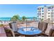 Enjoy panoramic ocean views from this balcony, featuring comfortable seating perfect for relaxation at 18400 Gulf Blvd # 1211, Indian Shores, FL 33785