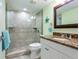Bathroom features modern fixtures, granite countertops, a glass shower, and a decorative starfish at 18400 Gulf Blvd # 1211, Indian Shores, FL 33785