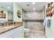 Bathroom featuring granite countertops, and a walk-in shower with decorative tile at 18400 Gulf Blvd # 1211, Indian Shores, FL 33785