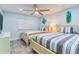 Bright bedroom showcases two beds, complemented by decor and a ceiling fan at 18400 Gulf Blvd # 1211, Indian Shores, FL 33785