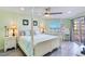 Serene bedroom with a four-poster bed, soft colors, and a lovely view of the ocean at 18400 Gulf Blvd # 1211, Indian Shores, FL 33785