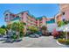 Beautiful tropical condo building with palm trees and parking at 18400 Gulf Blvd # 1211, Indian Shores, FL 33785