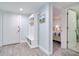Hallway featuring wood-look tile and a built-in hall tree at 18400 Gulf Blvd # 1211, Indian Shores, FL 33785