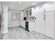 Eat-in kitchen with recessed lighting, wine storage, and stainless steel appliances at 18400 Gulf Blvd # 1211, Indian Shores, FL 33785