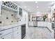 Open kitchen with wine storage, recessed lighting, and stainless steel appliances at 18400 Gulf Blvd # 1211, Indian Shores, FL 33785