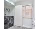 Laundry room with front load washer and dryer, and wood-look tile at 18400 Gulf Blvd # 1211, Indian Shores, FL 33785