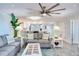Bright living room with modern decor, stylish furniture, and an open layout connecting to the kitchen at 18400 Gulf Blvd # 1211, Indian Shores, FL 33785