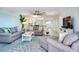 Spacious living room featuring comfortable seating, stylish decor, and an open concept design at 18400 Gulf Blvd # 1211, Indian Shores, FL 33785