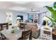Bright and open living space featuring a dining area with balcony access and a view to the bedroom at 18400 Gulf Blvd # 1211, Indian Shores, FL 33785