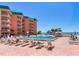 Inviting community pool with lounge chairs offers a relaxing outdoor experience at 18400 Gulf Blvd # 1211, Indian Shores, FL 33785