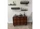 Stylish bar area with glassware and a wooden cabinet at 19113 Doves Landing Dr, Tampa, FL 33647