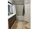Bathroom featuring a modern vanity with sleek fixtures and a shower-tub combination at 19113 Doves Landing Dr, Tampa, FL 33647