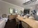 Open dining room with stylish furniture, a mirror, and elegant lighting at 19113 Doves Landing Dr, Tampa, FL 33647