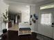 Welcoming entryway with a decorative bench, storage baskets, and a view into the home at 19113 Doves Landing Dr, Tampa, FL 33647