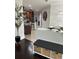 Inviting entryway showcasing decorative storage baskets, neutral colors, and a glimpse into the kitchen at 19113 Doves Landing Dr, Tampa, FL 33647