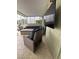 Comfortable covered patio with seating and TV for relaxing and entertainment at 19113 Doves Landing Dr, Tampa, FL 33647