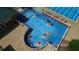 Overhead view of large splash pad with colorful water features and lounge seating for relaxation at 19113 Doves Landing Dr, Tampa, FL 33647