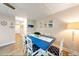 Dining room with seating for six, wood-look flooring, and coastal décor at 19823 Gulf Blvd # 42, Indian Shores, FL 33785
