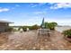 Back patio area with patterned brick flooring, a white fence, and outdoor seating with a picnic table at 19823 Gulf Blvd # 42, Indian Shores, FL 33785