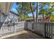 Fenced backyard showing a private outdoor space, lush foliage, and carport, perfect for relaxing or entertaining at 20 Iris Pl, Oldsmar, FL 34677