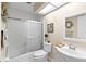 Well-lit bathroom with a shower-tub combination, white tile, and vanity sink at 20 Iris Pl, Oldsmar, FL 34677
