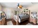 Comfortable bedroom with a four-poster bed, hardwood floors, and natural light from sliding glass doors at 20 Iris Pl, Oldsmar, FL 34677