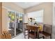 Bright breakfast nook with a table, two chairs and sliding glass doors leading to the outside at 20 Iris Pl, Oldsmar, FL 34677