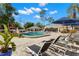 Community pool deck with ample seating, lounge chairs, and a gazebo at 20 Iris Pl, Oldsmar, FL 34677