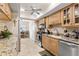 Functional kitchen with stainless steel appliances, tile backsplash, and ample counter space for meal preparation at 20 Iris Pl, Oldsmar, FL 34677