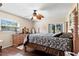 Spacious bedroom with hardwood floors, ceiling fan, and a sliding glass door at 20 Iris Pl, Oldsmar, FL 34677