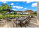 Outdoor patio seating area with comfortable chairs and umbrellas offering a pleasant dining experience at 20 Iris Pl, Oldsmar, FL 34677