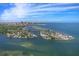 Picturesque aerial view of waterfront homes on a peninsula with stunning ocean and city views at 2310 Sunrise Se Dr, St Petersburg, FL 33705