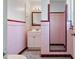 Charming bathroom featuring a retro design, tiled shower and walls, and a new vanity at 2310 Sunrise Se Dr, St Petersburg, FL 33705