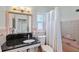 Charming bathroom featuring a granite countertop, retro tile work, and shower and tub combo at 2310 Sunrise Se Dr, St Petersburg, FL 33705