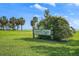 A photo of the Lassing Park sign with lush green grass and mature trees in the background at 2310 Sunrise Se Dr, St Petersburg, FL 33705