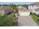 An aerial view of this home showcases its well-maintained landscaping and serene neighborhood setting at 2632 Tarragona Way, Wesley Chapel, FL 33543