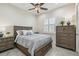 Comfortable bedroom featuring a ceiling fan, shutters, and neutral decor at 2632 Tarragona Way, Wesley Chapel, FL 33543