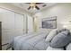 Comfortable bedroom featuring a ceiling fan, a large closet, and neutral decor at 2632 Tarragona Way, Wesley Chapel, FL 33543