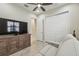 Bonus room with a large TV, ceiling fan, and closet for storage and media at 2632 Tarragona Way, Wesley Chapel, FL 33543